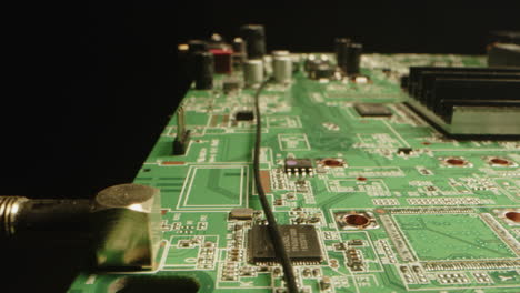 beautiful macro view of a circuit board with microchips and diodes in a black studio