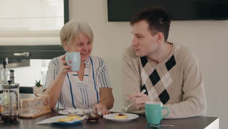 grandmother and grandson enjoying breakfast together