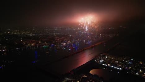 july 4 fireworks at marina del rey explode into dark sky cloud, aerial