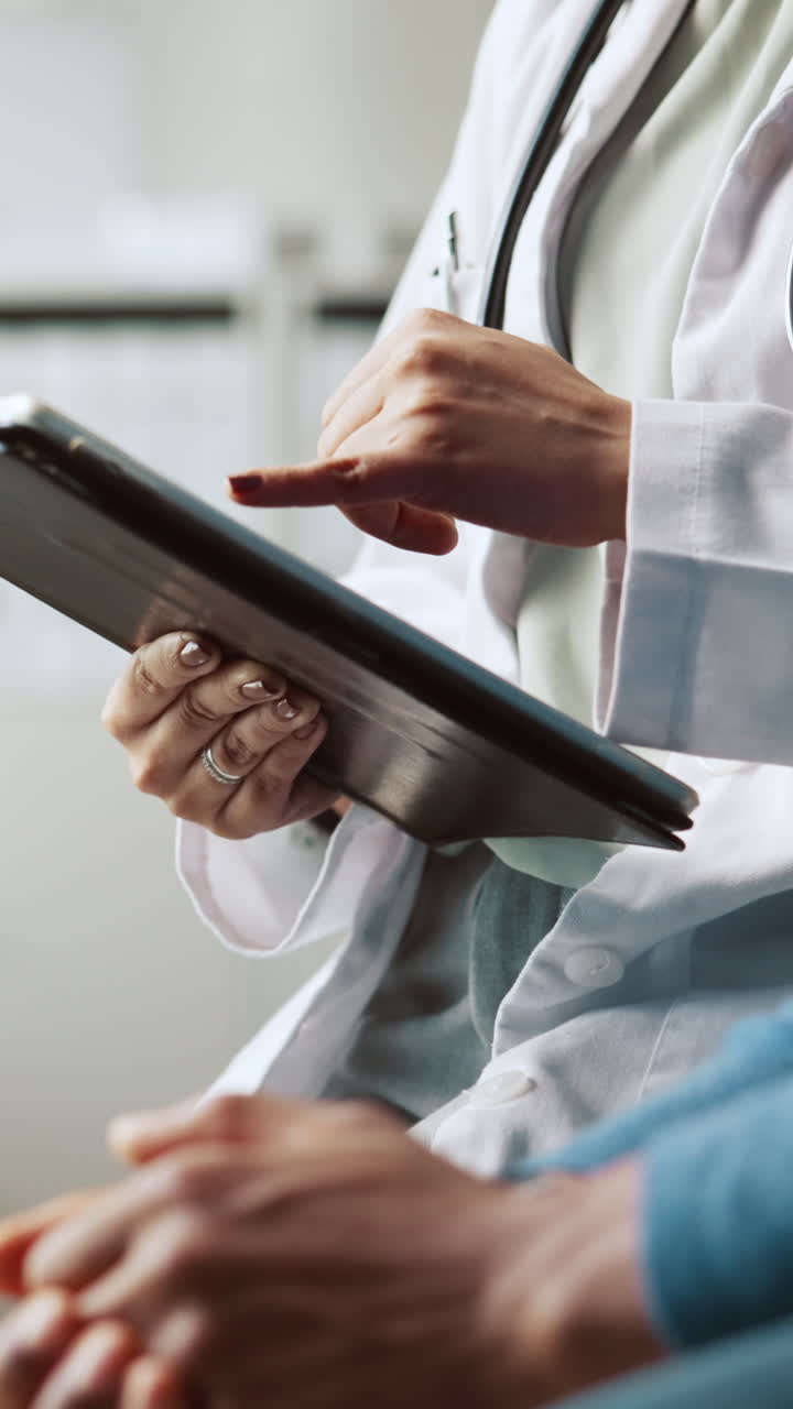 Doctor and Patient Discussing Medical Information on Digital Tablet
