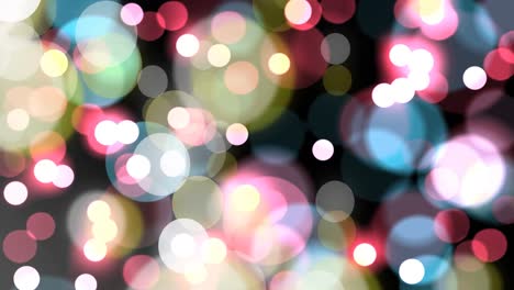 Animation-of-spots-falling-over-christmas-lights