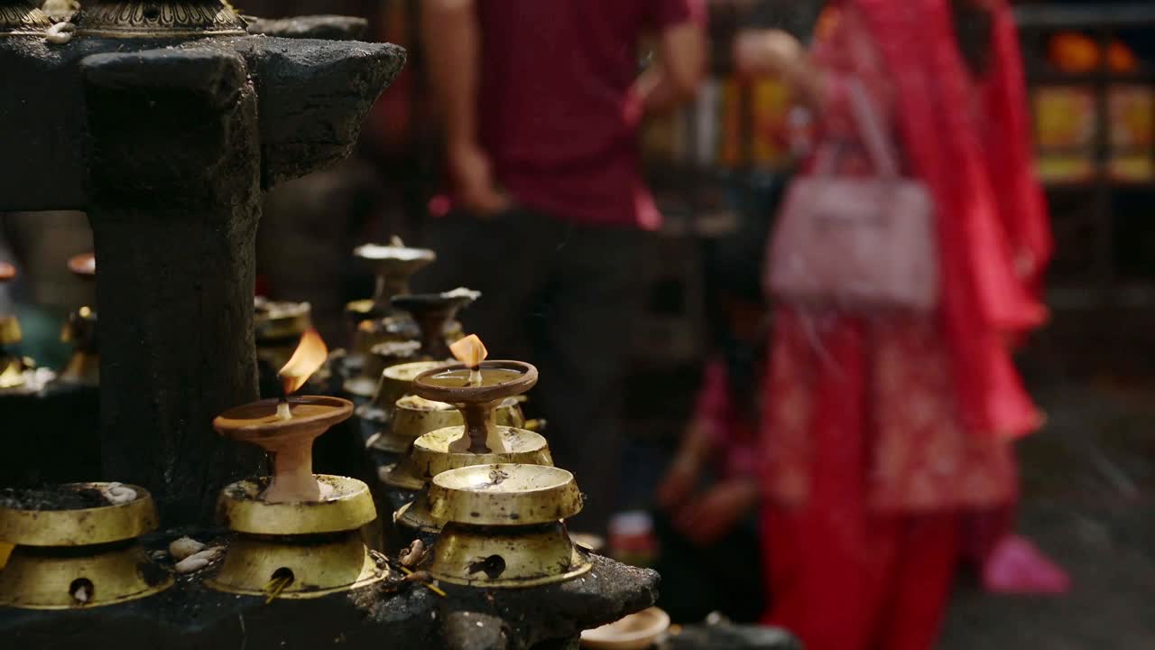 Candles and Hindu People Praying at a Religious Ceremony, Hindu Religion People in Prayer at a Hindu Religious Temple in Kathmandu in Nepal, Close Up of a Religious Festival and Praying Rituals