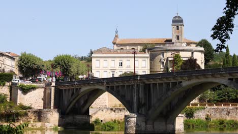 people walking on a historic bridge