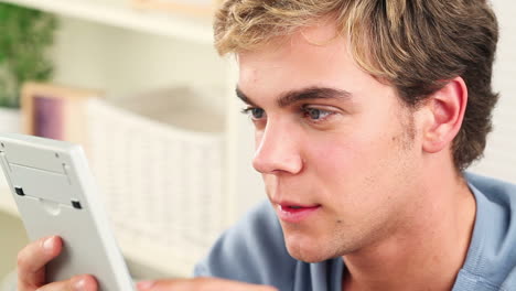 young man using calculator