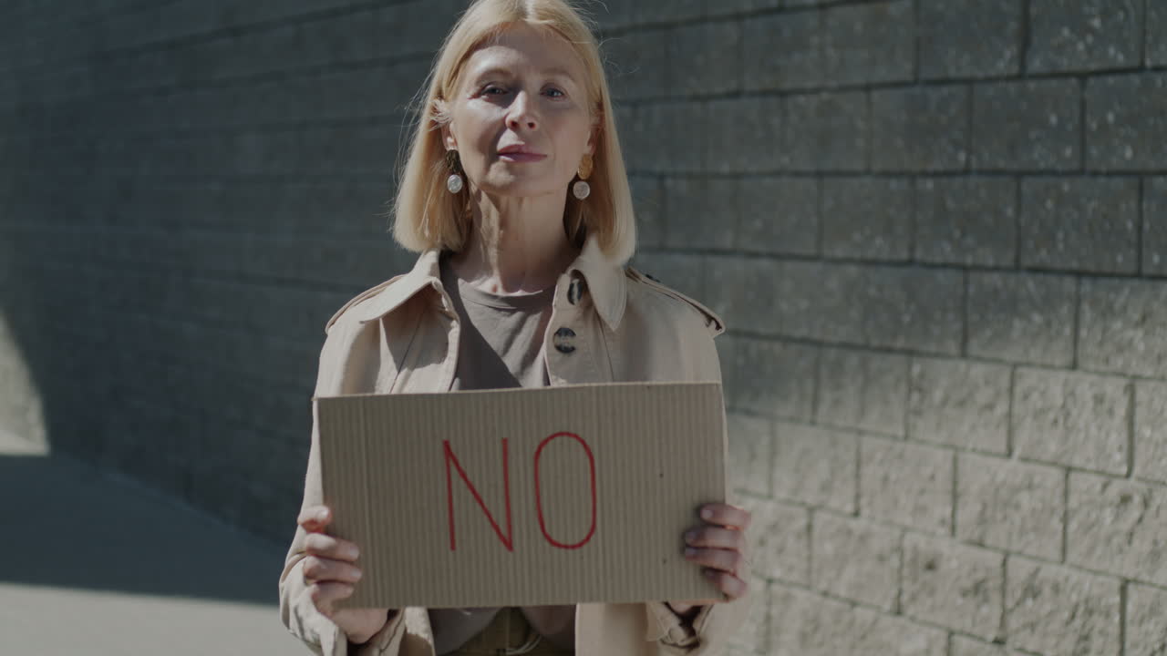Senior Woman Holding a "No" Sign