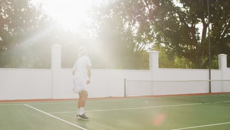 tennis players smashing the ball