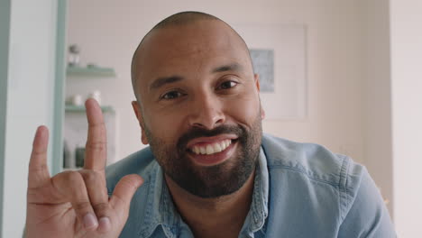 attractive-young-man-having-video-chat-using-sign-language-on-webcam-at-home-chatting-sharing-lifestyle-enjoying-online-communication-on-horizontal-screen