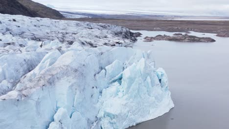 retreating ice glacier upvalley in iceland, global warming impact, aerial