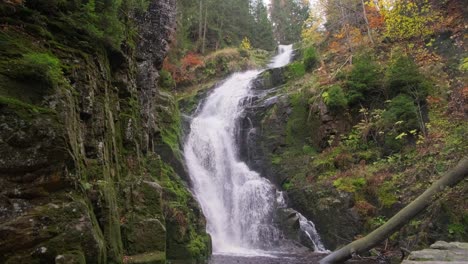 slow motion of beautiful waterfall in the middle of lush forest slow motion of beautiful waterfall in the middle of lush forest