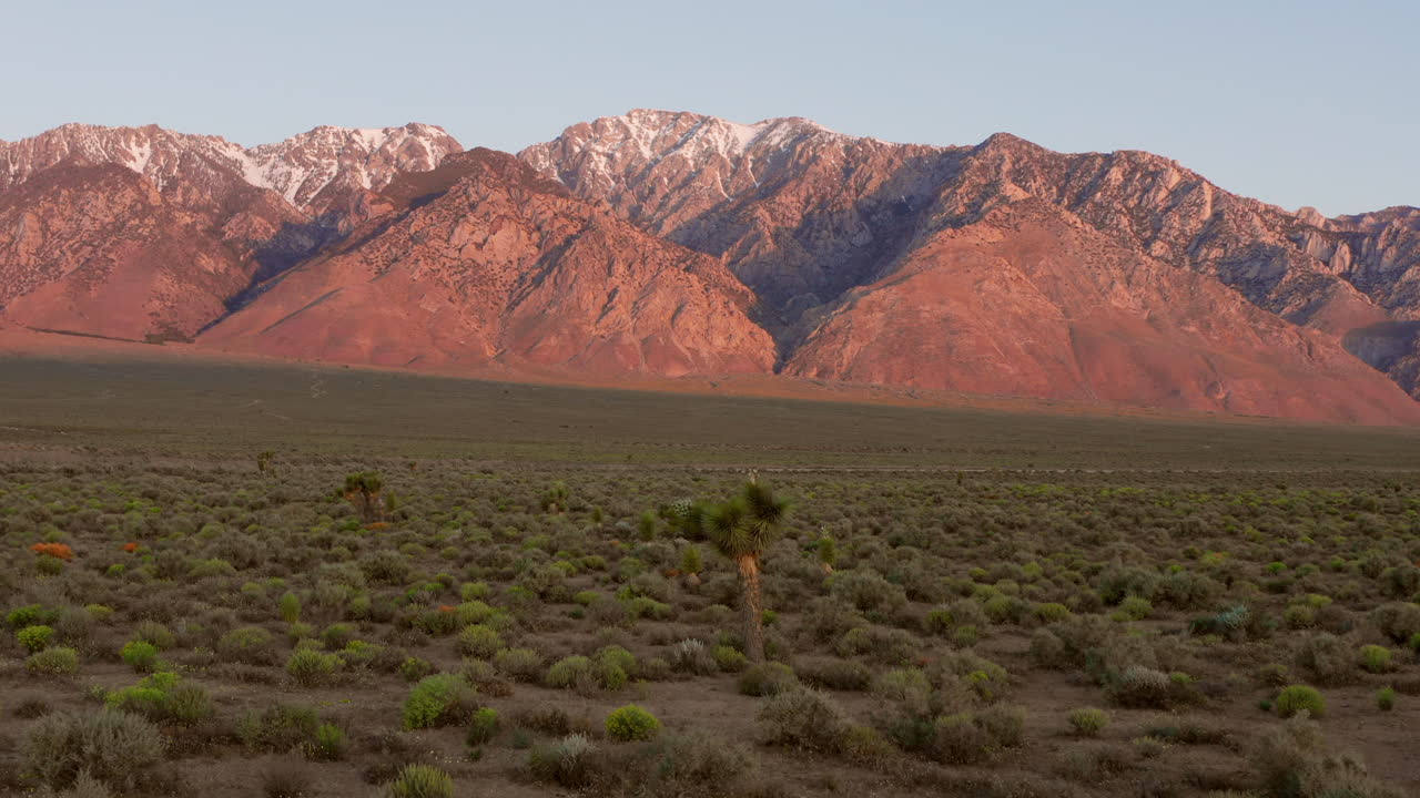 The snowy mountains of the Sierra Nevada during sunrise. Aerial shot