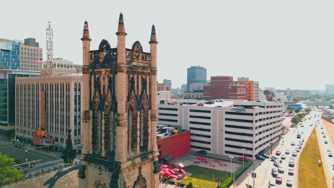 Detroit, USA, 28 July 2025: Footage around the tower of St. John's Episcopal Church in the historic part of Detroit, Michigan, USA. Busy streets of the city at backdrop