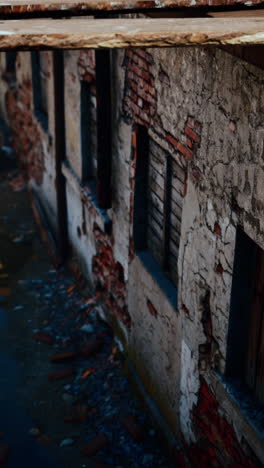 abandoned building with crumbling brick wall