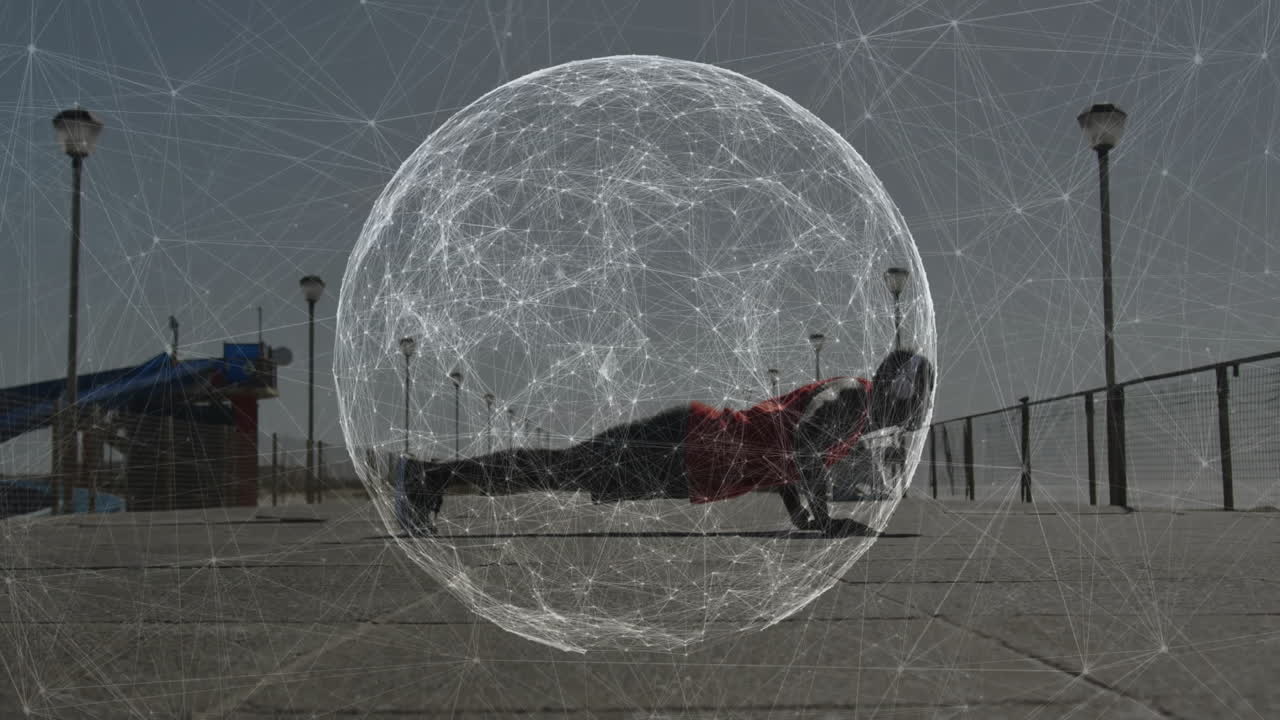 man performing push-ups on concrete promenade, with animated wireframe sphere showing fitness tech