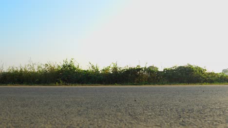 unrecognizable silhouette of man working out riding bike summer mourning outdoors