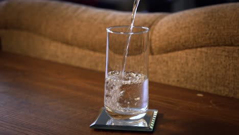 still take of water pouring into a glass in 4k