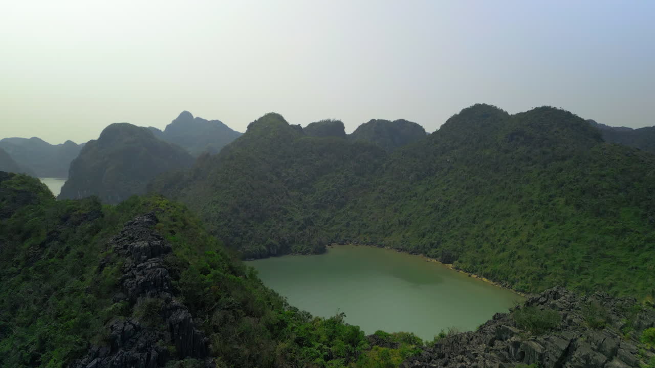 Forested Mountains During Foggy Morning In Halong Bay, Vietnam. Aerial Drone Shot