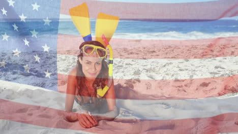 animation of flag of usa over caucasian woman on beach in summer