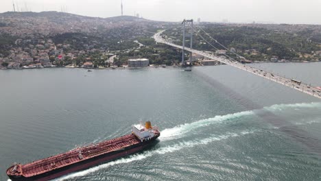 ship passing istanbul bridge aerial view