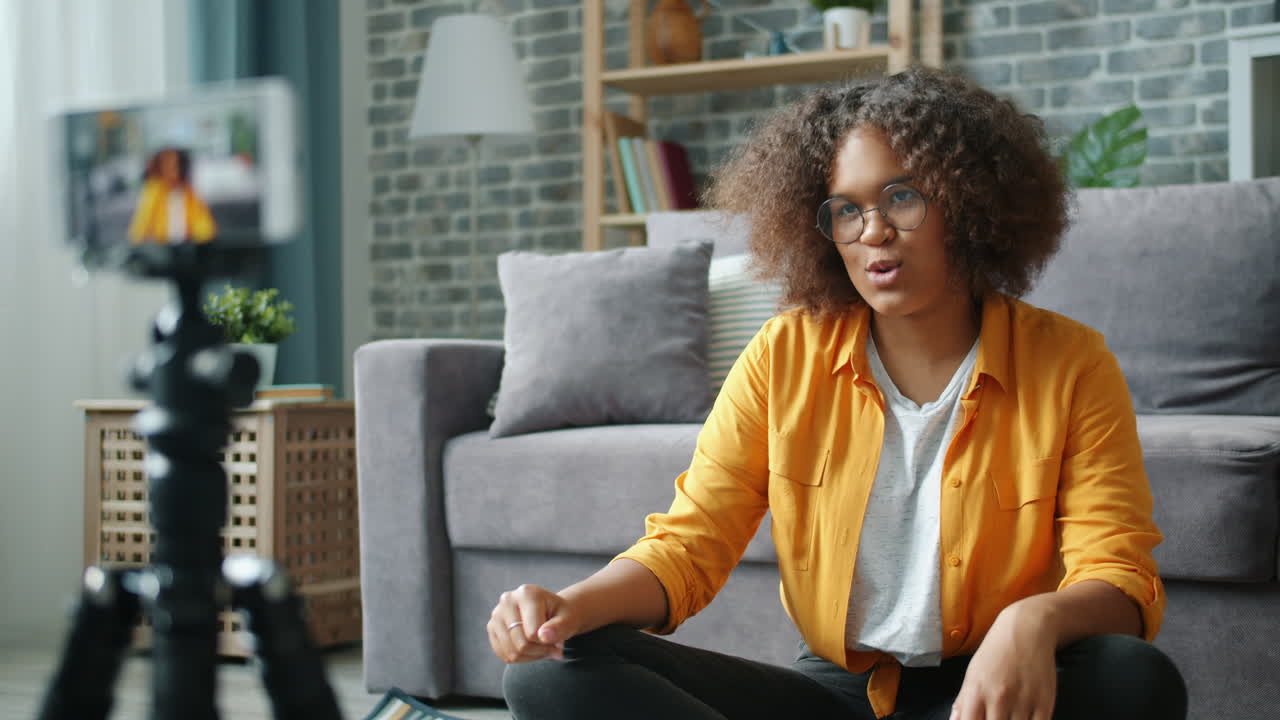 Young Woman Vlogging in Living Room