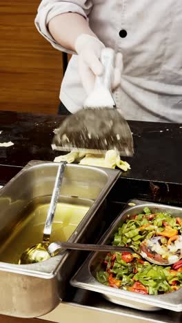 chef preparing breakfast omelette