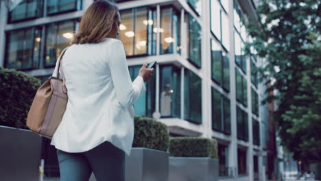 Beautiful-mixed-race-business-woman-walking-through-city