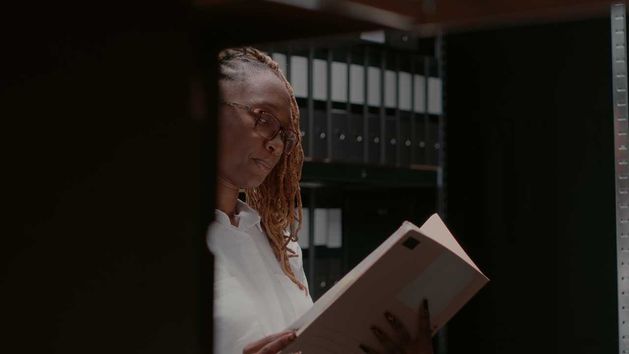 Woman organizing documents in office