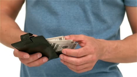 mid section on man picking money from wallet