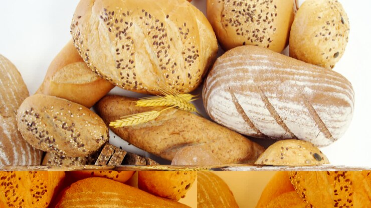 Various bread loaves with wheat grains