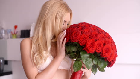 Sexy-Woman-in-White-Bra-Holding-a-Rose-Bouquet