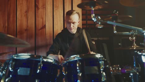 drummer playing drums in a studio