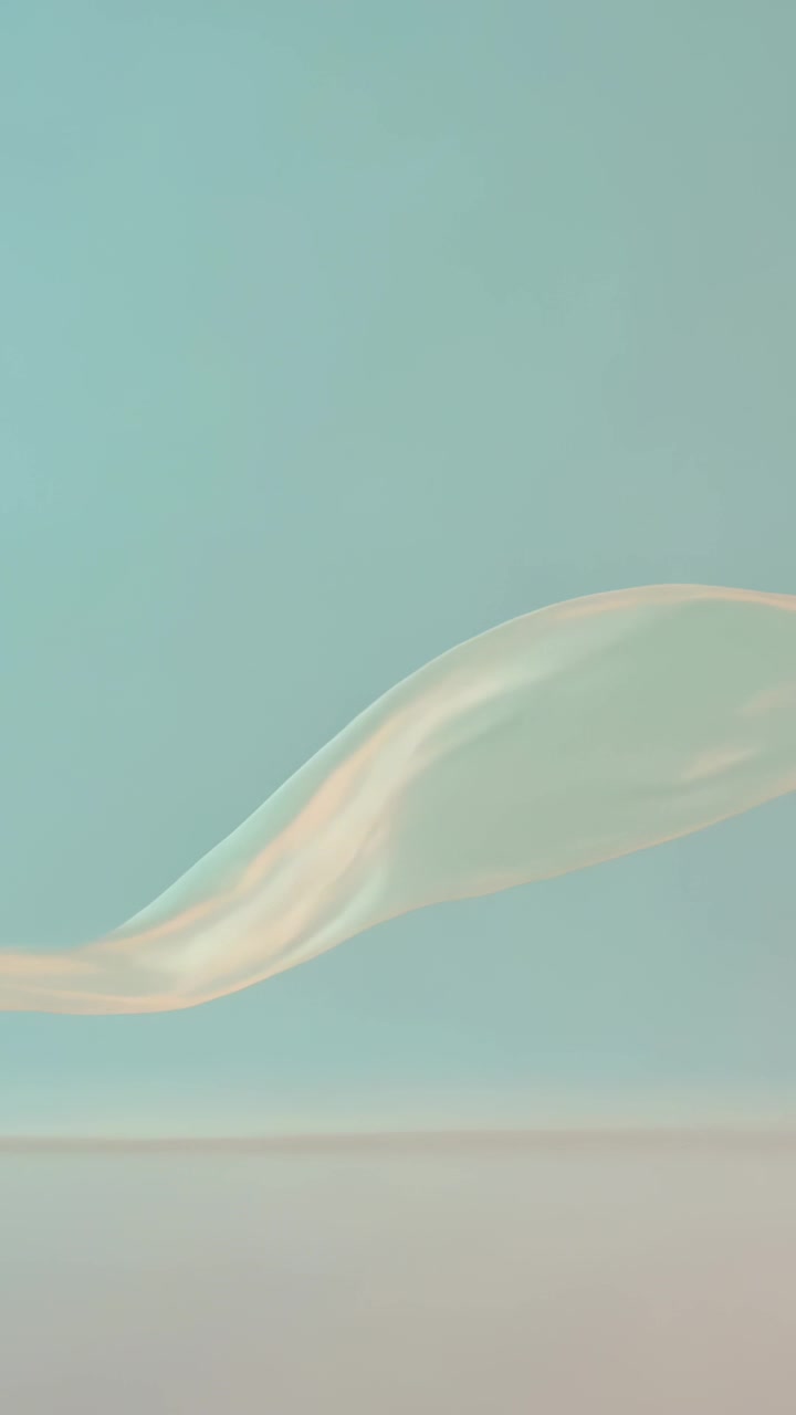 垂直影片：畫面轉換，讓緞帶飄過桌面，呈現綠色和桃色調。