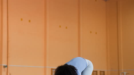 woman stretching indoors