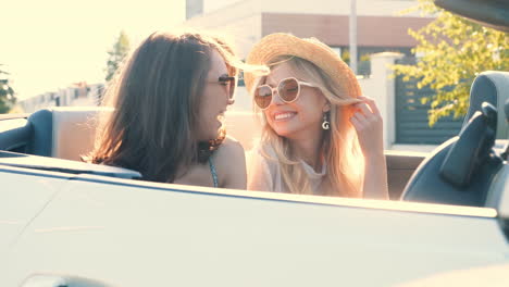 happy women friends enjoying a summer roadtrip