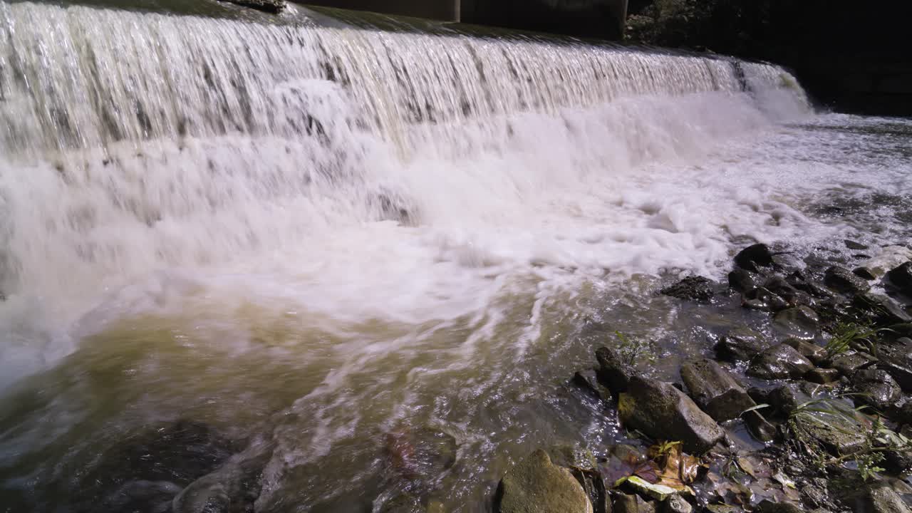 Water Crashing onto Rocks in River in Jasper, IN on a Bright Sunny Day