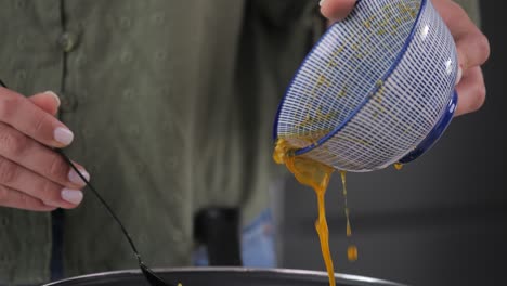 cooking, pouring sauce while making a meal