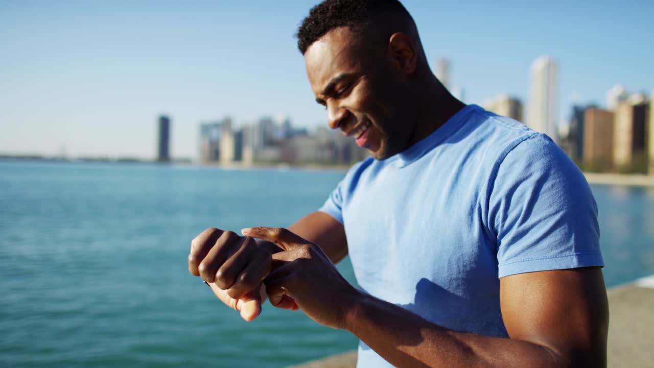 Profile of Ethnic male resting after workout outdoors
