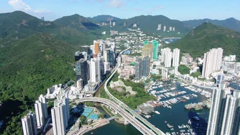 Aberdeen-harbour-and-skyline-in-southwest-Hong-Kong-island-on-a-beautiful-day,-Aerial-view