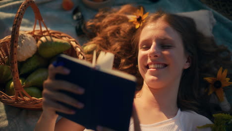 girl imagines adventures while lying on grass