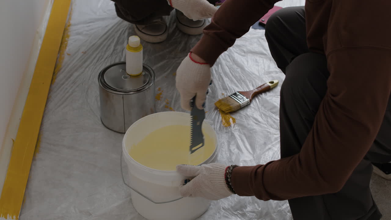 Mixing Paint for Wall Painting: A Home Improvement Project