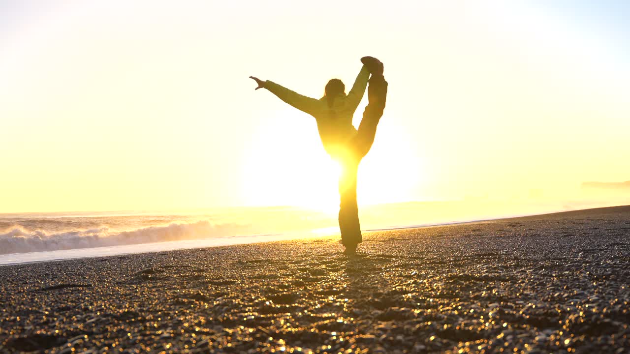 Woman on a Beach at Sunrise
