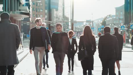 crowd of business people tracked with technology walking on busy urban city streets. cctv ai facial recognition big data analysis interface scanning, showing animated information.