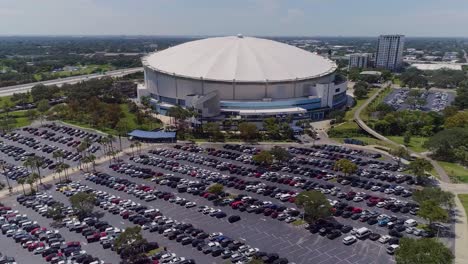 4k aerial drone video of tropicana field and full parking lot in downtown st