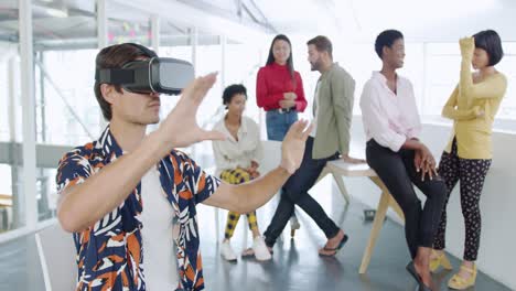 male creative using vr headset in a modern office