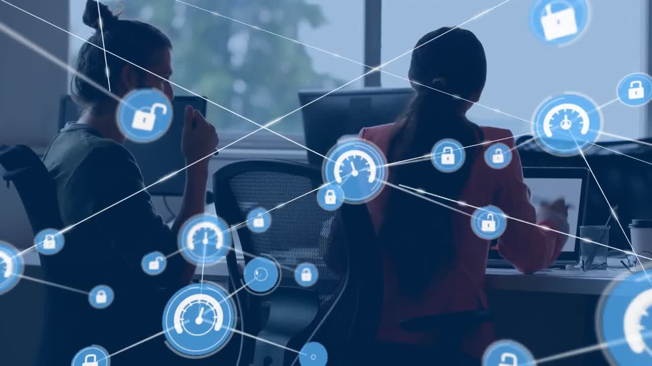 Animation of network of digital icons over diverse male and female colleagues discussing at office