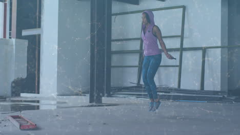 animation of network of connections over woman jumping the rope in an abandoned building