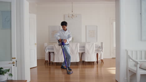 funny-man-dancing-with-vacuum-cleaner-at-home-celebrating-success-with-weird-victory-dance-moves-having-fun-doing-chores-feeling-successful-4k