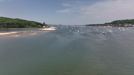 A-low-angle-view-of-the-Northport-Marina-on-Long-island,-NY-with-several-anchored-boats