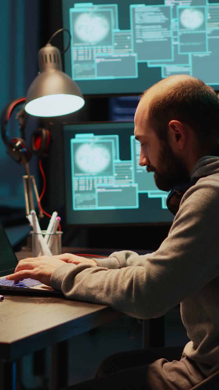 Vertical video: Young IT criminal hacking server to destroy information
