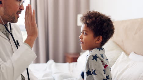 Bed,-stethoscope-and-pediatrician-high-five-kid