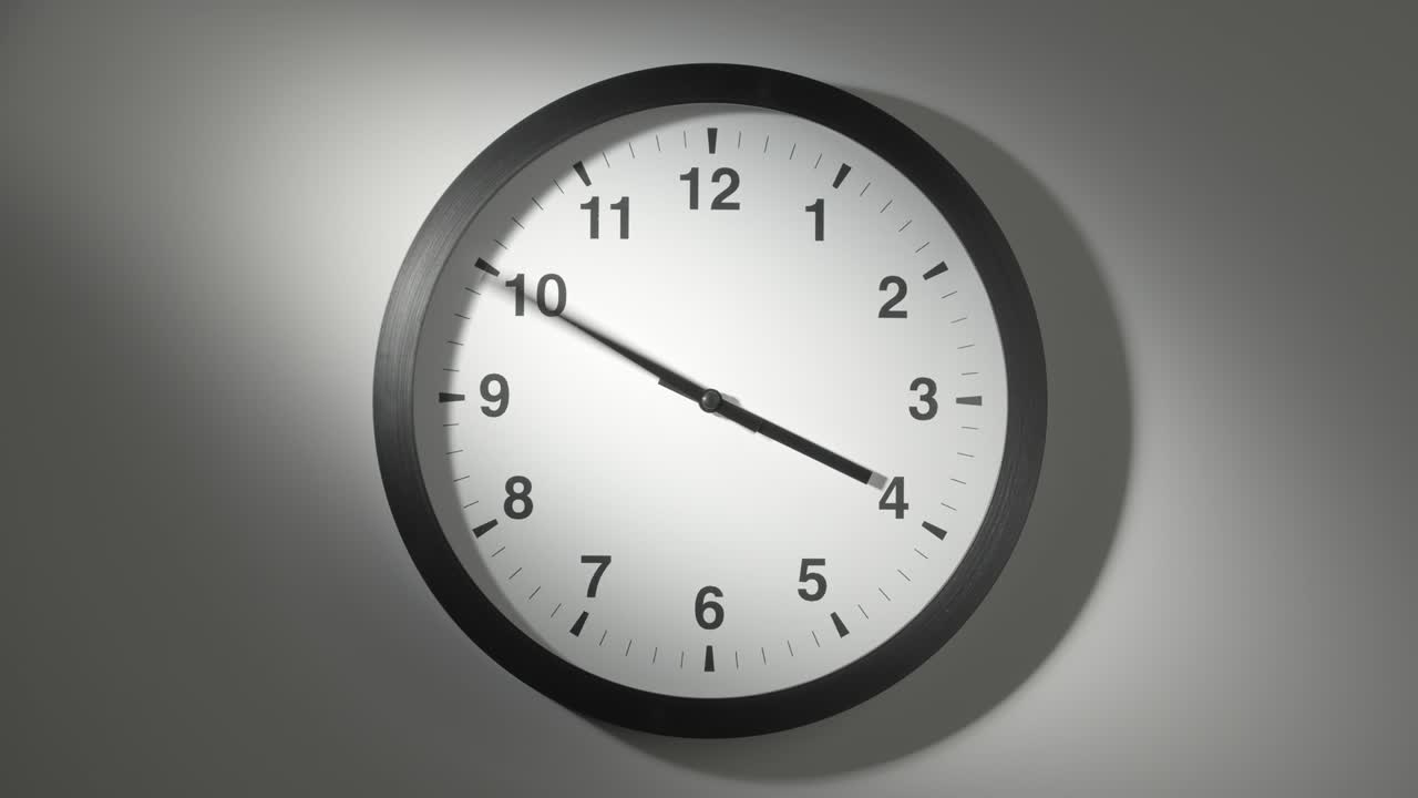 Clock Face in Time Lapse on White Wall in Office